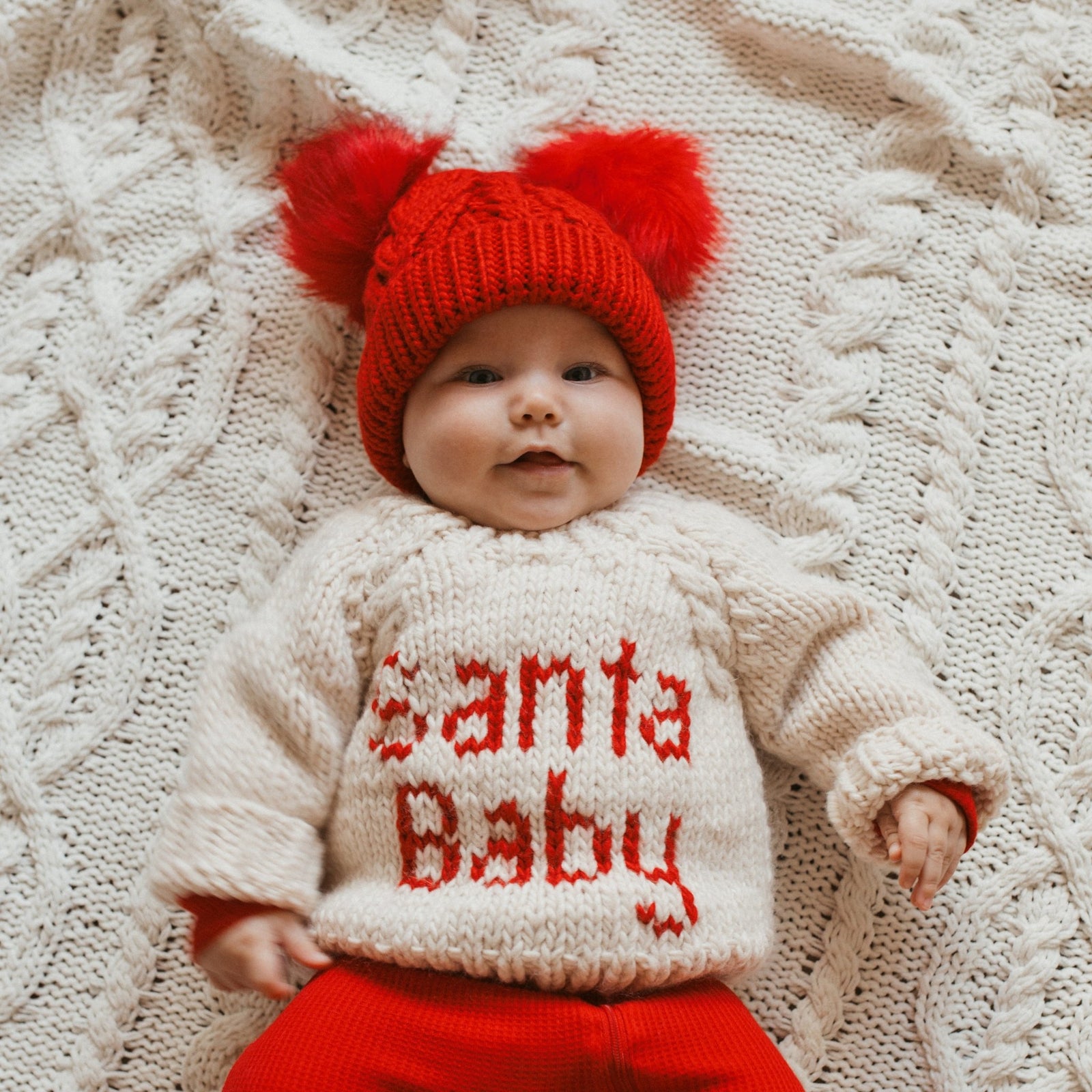 Baby red bobble hat on sale